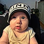Storey joined the competition — help win amazing prizes! baby, child, infant, hat, blue_eyes, chubby_cheeks, indoor, person, cute, sitting, knit_hat, clothing, face, expression, dog, plant, furniture, blanket, cozy, portrait