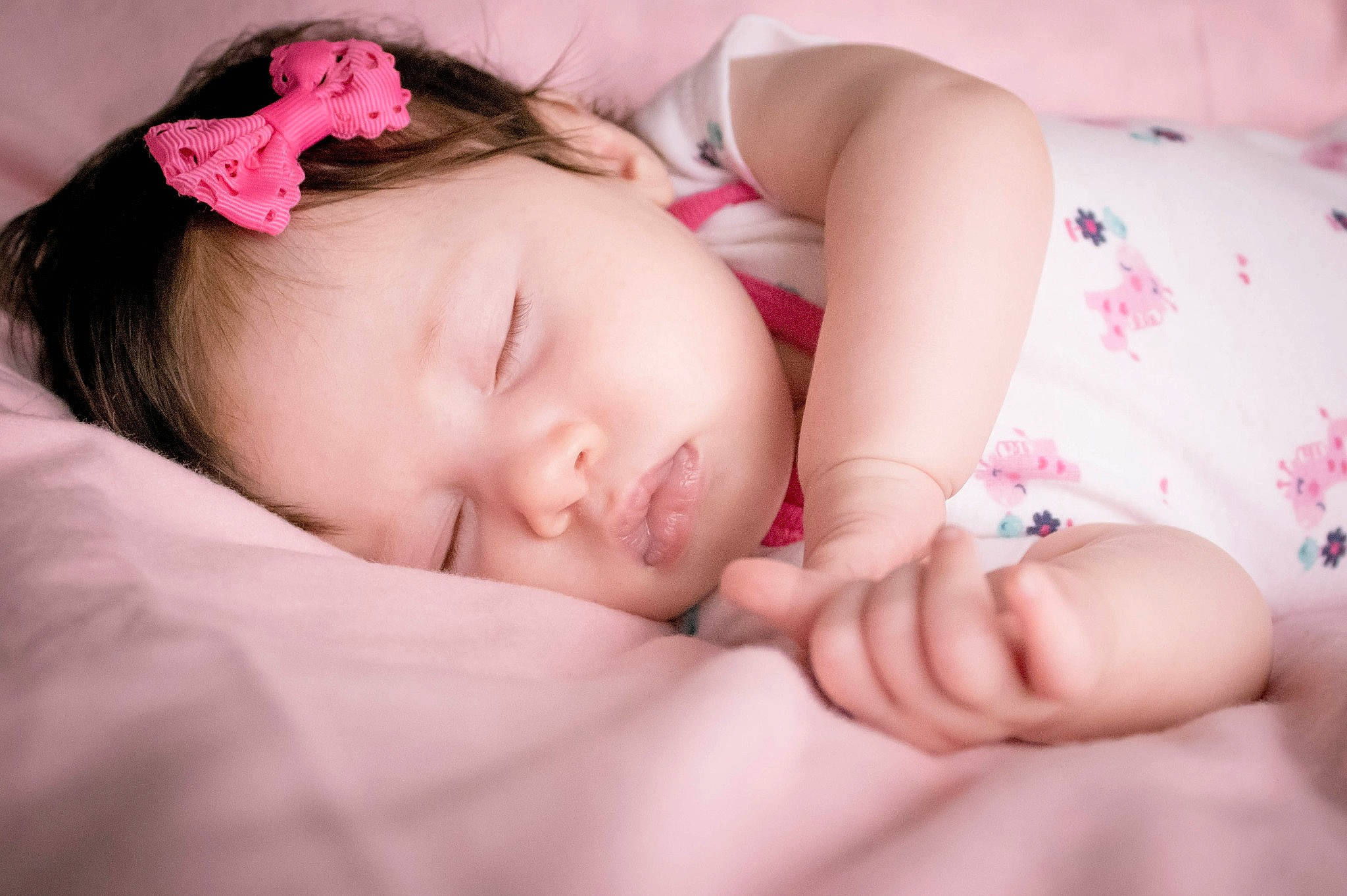 Carly is registered to the contest to win money with this photo: baby, baby_sleeping, beauty, cheek, child, close_up, eye, face, hair_accessory, hand, head, headband, lip, nap, nose, person, photograph, pink, skin, sleep