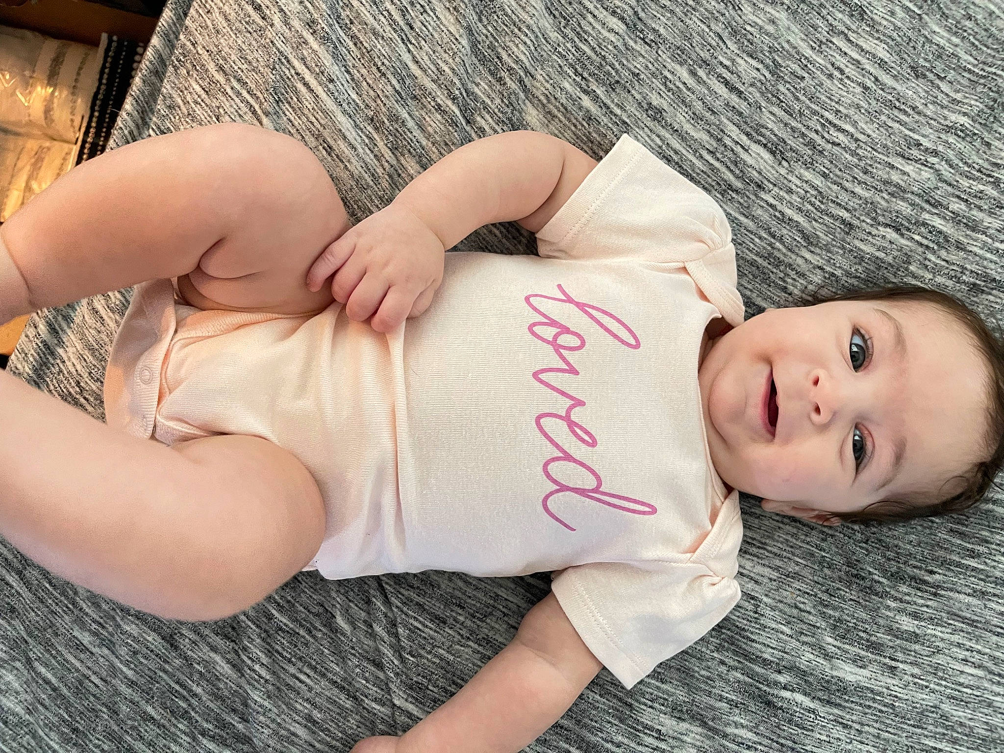 Juliette is registered to the contest to win money with this photo: arm, clothing, comfort, eye, facial_expression, glasses, hair, hand, head, human_body, joint, leg, lip, mouth, muscle, neck, organ, person, skin, stomach