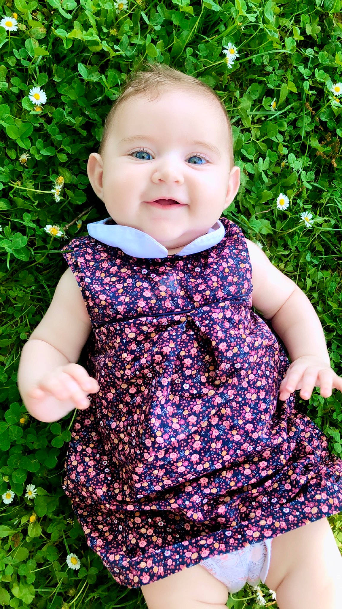Rubie participe au concours pour gagner de l'argent avec cette photo : baby, baby_toddler_clothing, botany, child, day_dress, grass, green, joy, leaf, one_piece_garment, outerwear, pattern, people_in_nature, person, pink, plant, product, purple, sleeve, smile