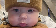 Easton joined the competition — help win amazing prizes! baby, infant, child, beanie, knit_hat, carhartt_label, overalls, bib, chubby_cheeks, eyes, lips, close_up, portrait, indoor, store, wooden_railing, soft_lighting, brown_clothing, adorable, casual_clothing