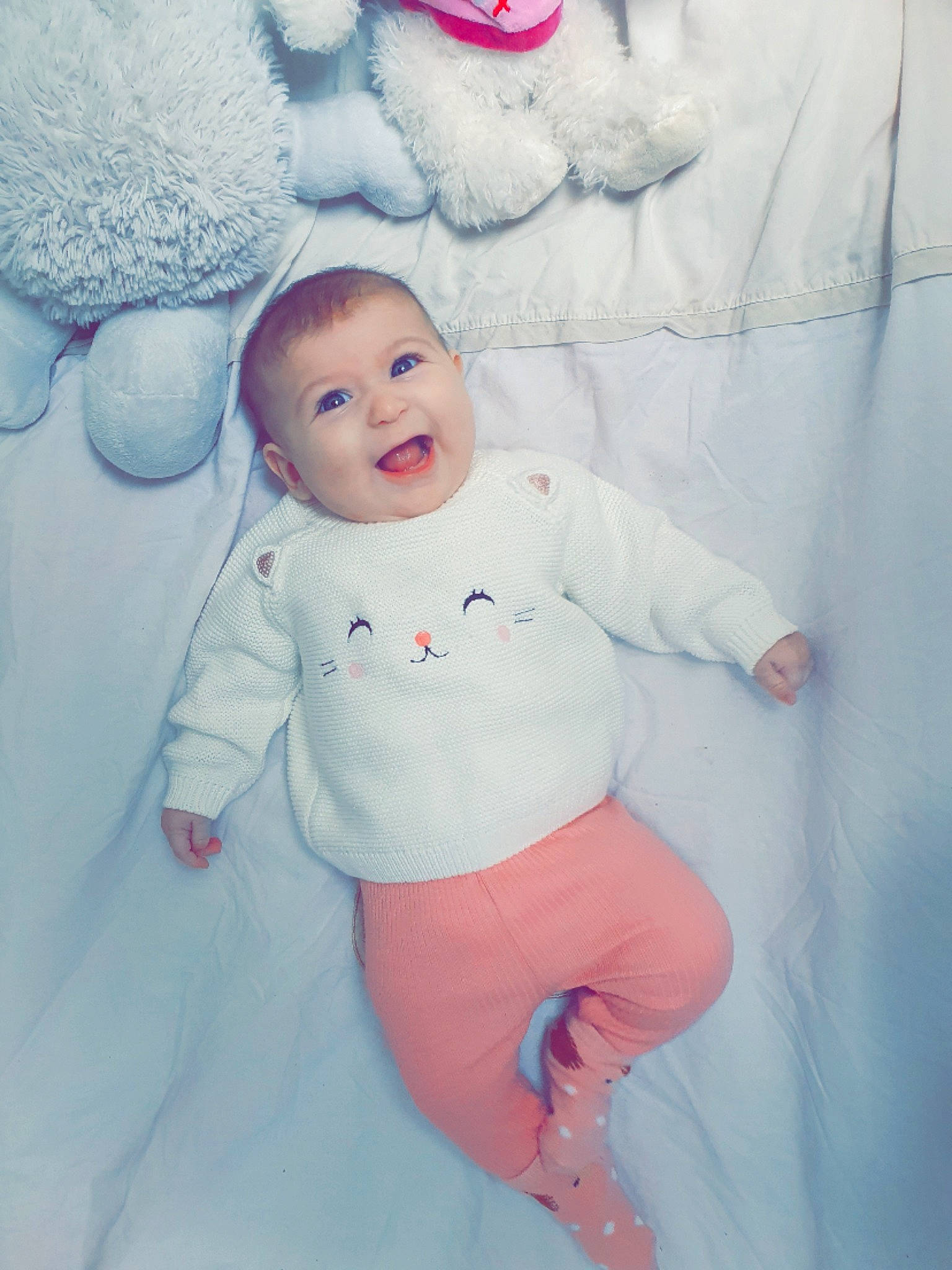 Shelsy participe au concours pour gagner de l'argent avec cette photo : baby, baby_toddler_clothing, cheek, child, comfort, eye, fun, fur, happy, laugh, linens, person, pink, portrait_photography, sitting, sleeve, smile, textile, toddler, white