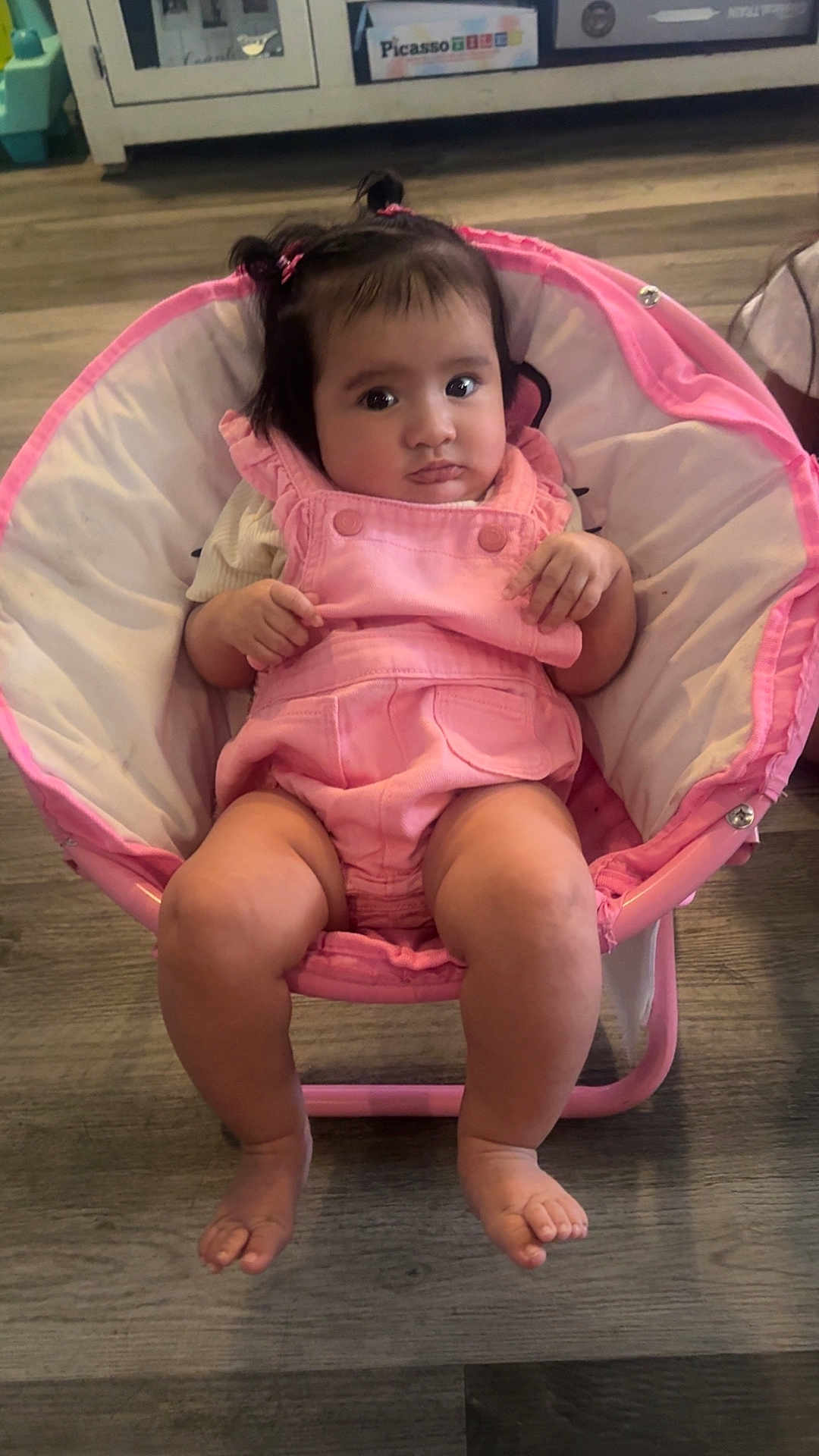 Adianney joined the competition — help win amazing prizes! baby, child, pink, chair, indoor, floor, pigtails, cute, clothing, person, infant, seated, legs, feet, wood_floor, expression, hair, furniture, room, portrait