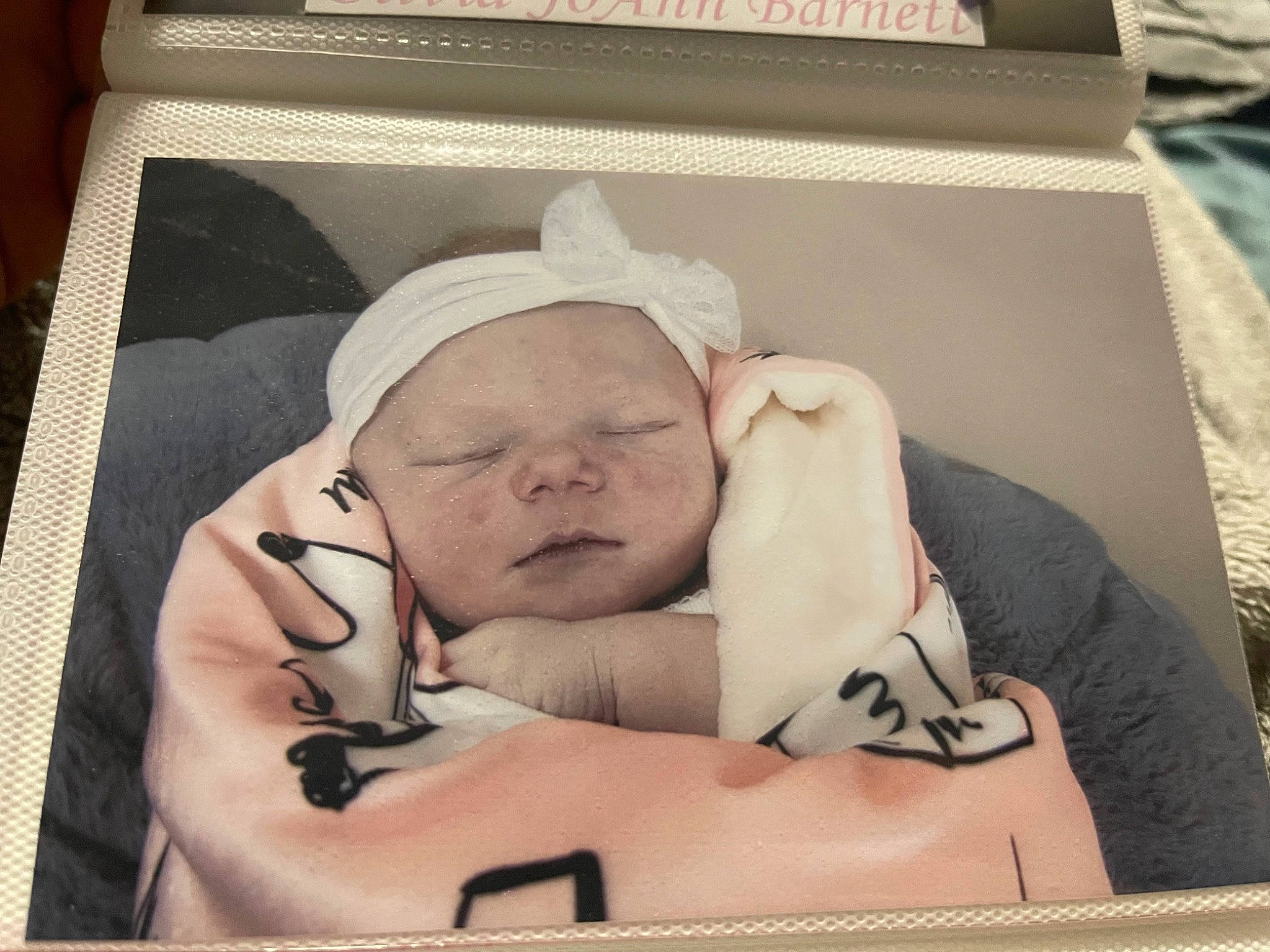 Olivia is registered to the contest to win money with this photo: art, baby, baby_products, baby_safety, baby_sleeping, baby_toddler_clothing, bedtime, box, child, comfort, headwear, illustration, linens, nap, person, photo_caption, picture_frame, room, sleep, toddler