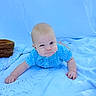 baby, infant, tummy_time, blue_shirt, blanket, basket, indoor, curious_expression, child, cute, portrait, young_child, person, clothing, skin, head, hand, face, crawling, closeup