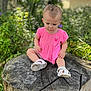 Tommie-Rose joined the competition — help win amazing prizes! toddler, child, pink_dress, tree_stump, outdoor, nature, plants, flowers, greenery, sandals, curious, sitting, young_child, daylight, casual_clothing, person, portrait, summer, baby, garden