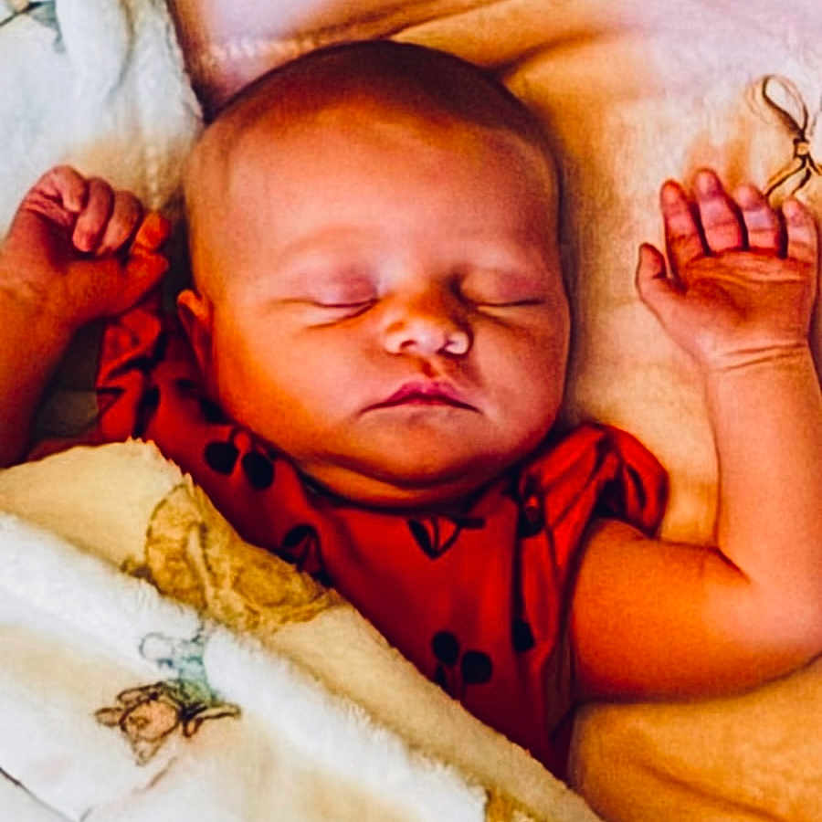 Fallon joined the competition — help win amazing prizes! baby, sleeping, blanket, infant, peaceful, soft, bed, child, cute, face, rest, comfort, skin, clothing, newborn, hands, portrait, indoors, nap, cozy