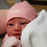Fallon joined the competition — help win amazing prizes! newborn, baby, infant, pink_hat, pink_clothing, towel, wrapped, closeup, face, eyes, soft_texture, cute, human, portrait, indoors, newborn_clothes, baby_gloves, skin, baby_fashion, warm