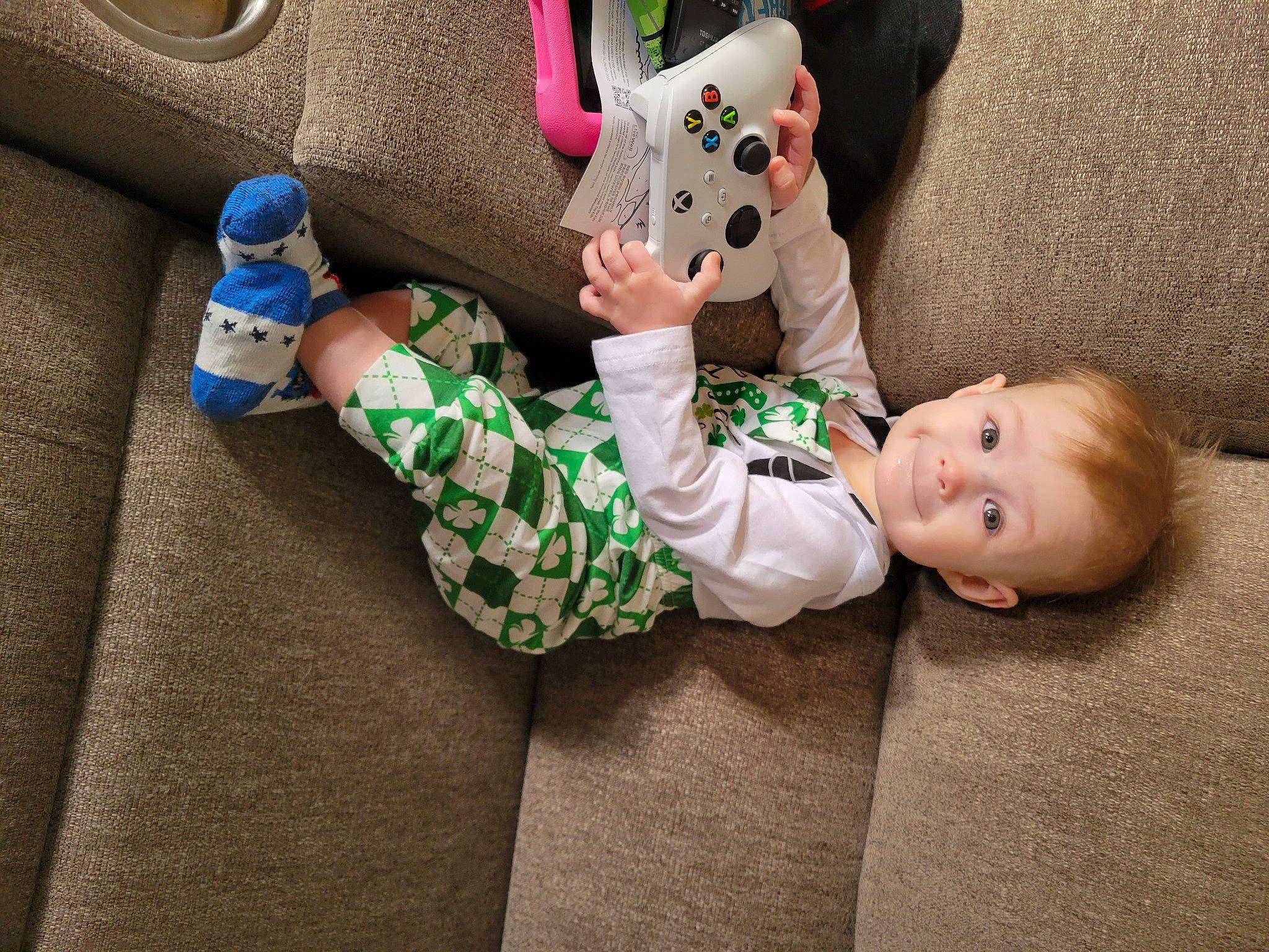 Bentley joined the competition — help win amazing prizes! baby, baby_toddler_clothing, bag, child, comfort, foot, grass, lap, leg, linens, person, shoe, sitting, skin, sleeve, sock, stuffed_toy, textile, thigh, toddler