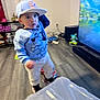 Michael joined the competition — help win amazing prizes! child, toddler, cap, hat, sweater, cartoon_character, mickey_mouse, standing, living_room, television, hardwood_floor, toy, shelf, speaker, motion_blur, shoes, playtime, furniture, indoors, casual_clothing