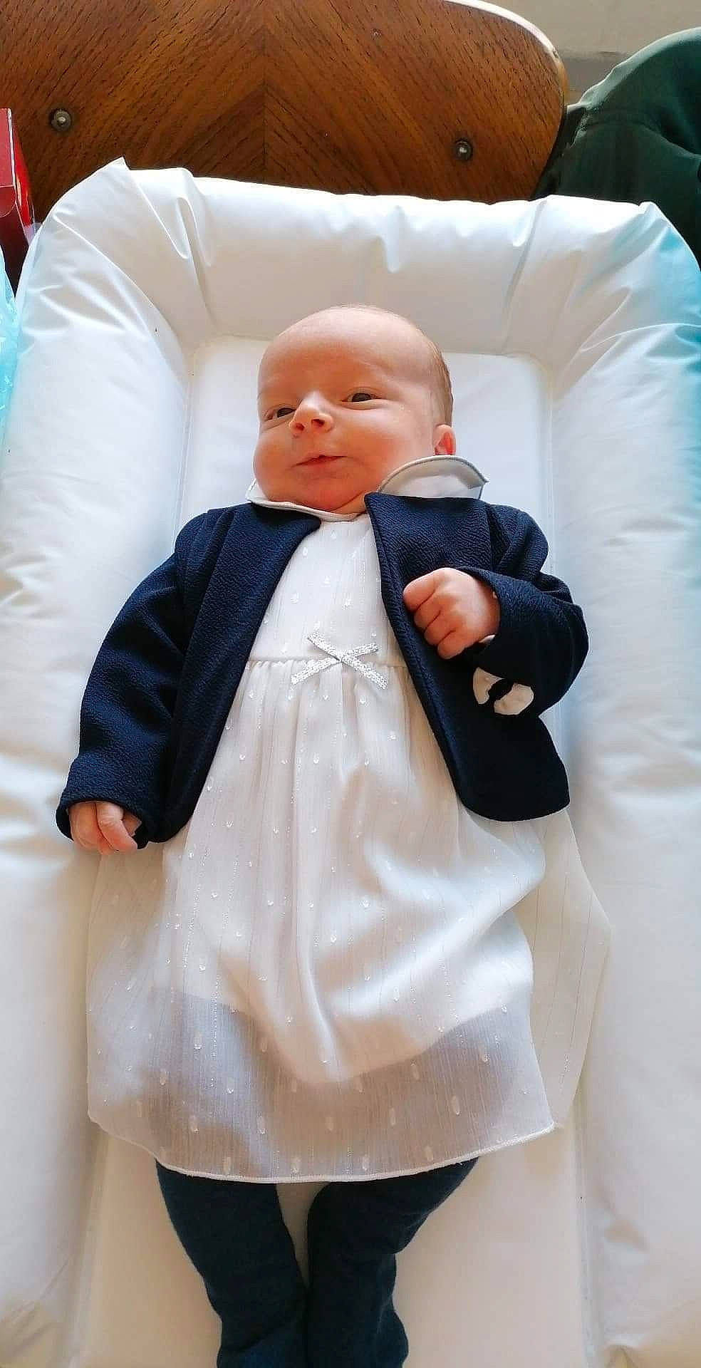 Louanne a rejoint le concours — aidez-le/la à gagner de superbes lots ! baby, baby_products, baby_safety, baby_sleeping, baby_toddler_clothing, child, collar, comfort, formal_wear, fur, gesture, linens, outerwear, person, room, sitting, sleeve, toddler