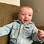 baby, buttoned_shirt, casual_clothing, child, comfortable, couch, cute, denim_shirt, face, happy, home, indoor, jeans, person, portrait, seated, short_hair, smiling, toddler, young_child