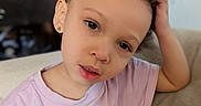 Octavia joined the competition — help win amazing prizes! anna, brown_eyes, child, close_up, colorful_clothing, couch, curious, curly_hair, earrings, elsa, fluffy_hair, frozen_shirt, girl, home, indoors, pink_shirt, portrait, seated, smiling, toddler