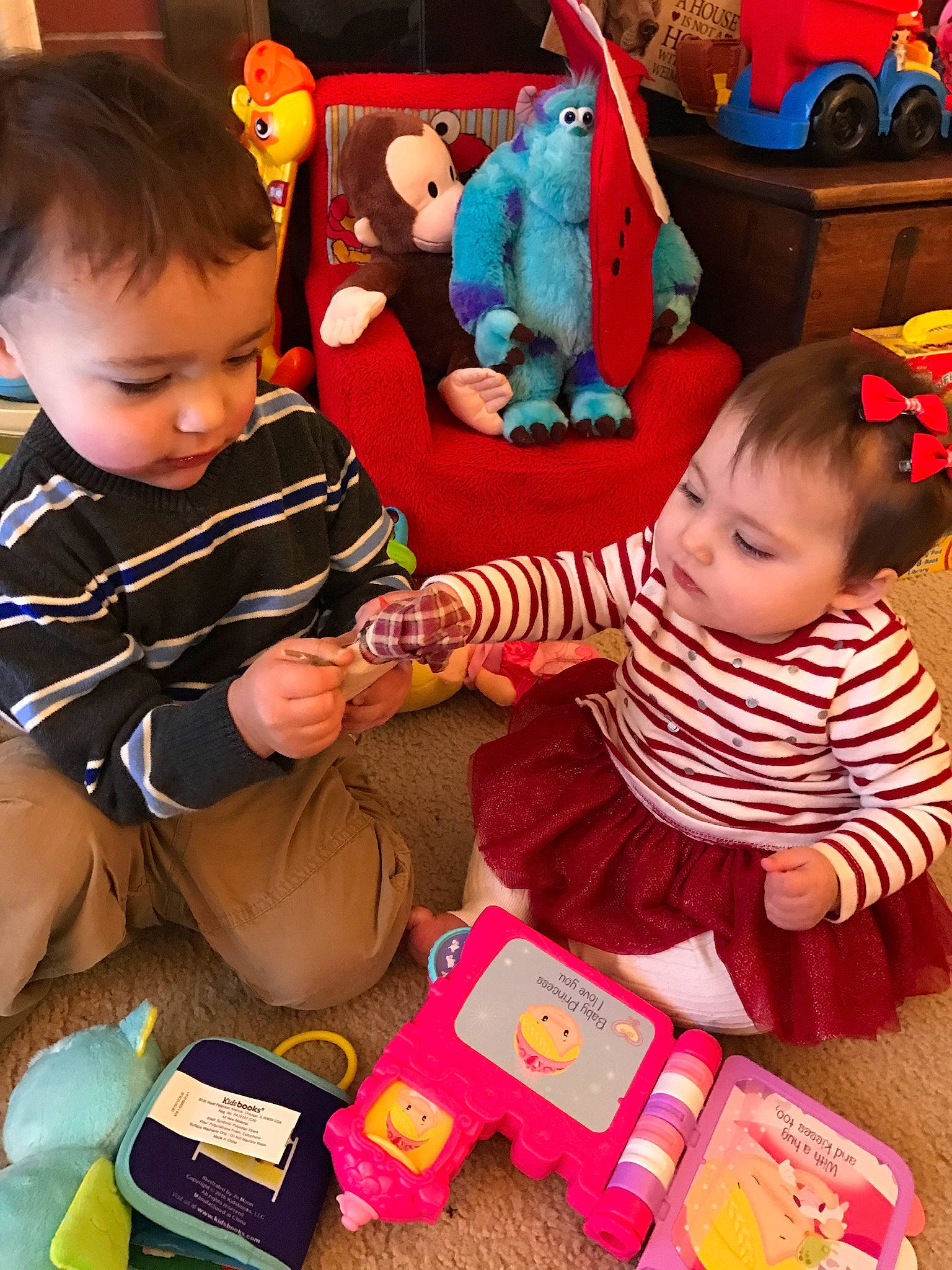 Addilyn is registered to the contest to win money with this photo: baby, baby_playing_with_toys, baby_toddler_clothing, baby_toys, child, event, fun, green, happy, holiday, lap, person, play, product, red, sharing, sitting, snapshot, toddler, toy