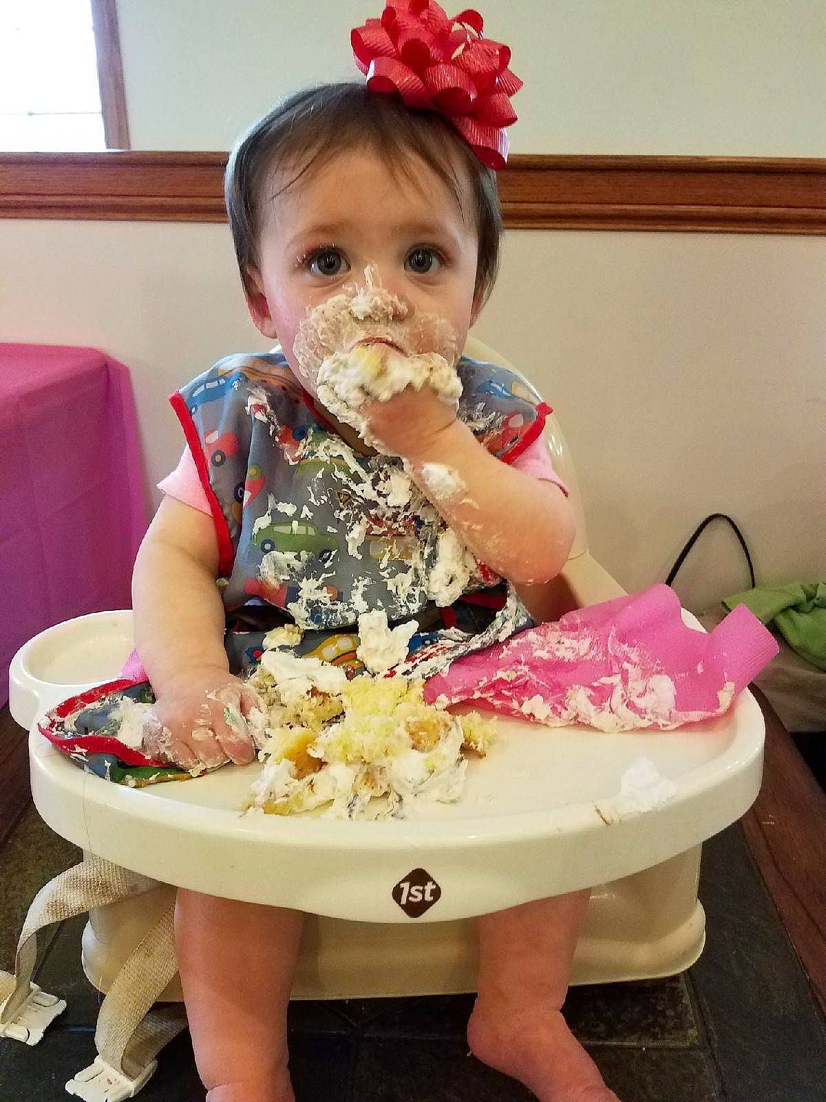 Addilyn is registered to the contest to win money with this photo: baby, baby_toddler_clothing, birthday, birthday_cake, cake, cake_decorating, chair, child, cuisine, dessert, dress, event, face, food, person, pink, sandal, sitting, sugar_cake, sweetness