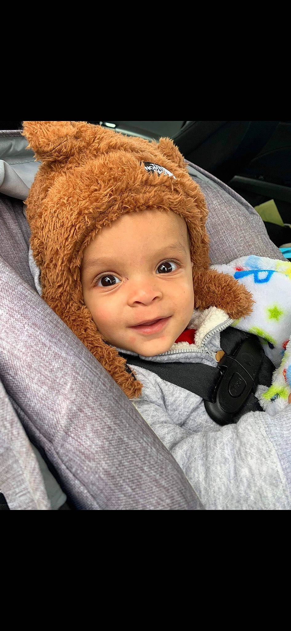 Giovanni is registered to the contest to win money with this photo: baby, baby_products, baby_toddler_clothing, cap, cheek, child, close_up, comfort, eye, flash_photography, happy, headgear, iris, jacket, nose, outerwear, person, skin, smile, textile