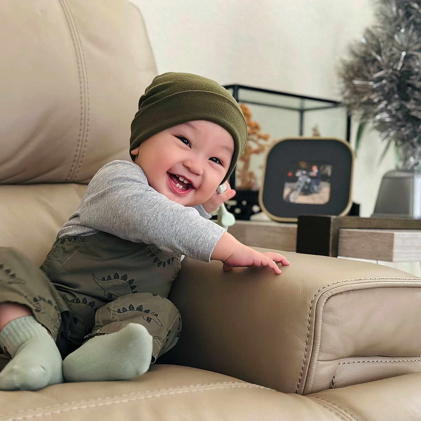 Niqolas joined the competition — help win amazing prizes! baby, babylaughing, cap, clothing, couch, cushion, face, furniture, happy, hat, head, homedecor, hosiery, laughing, person, sitting, smile, sock