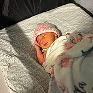 Isabella Marie is registered to the contest to win money with this photo: baby, bed, blanket, bonnet, cap, clothing, crib, face, furniture, hat, head, infantbed, newborn, person, photography, portrait, quilt, sleeping