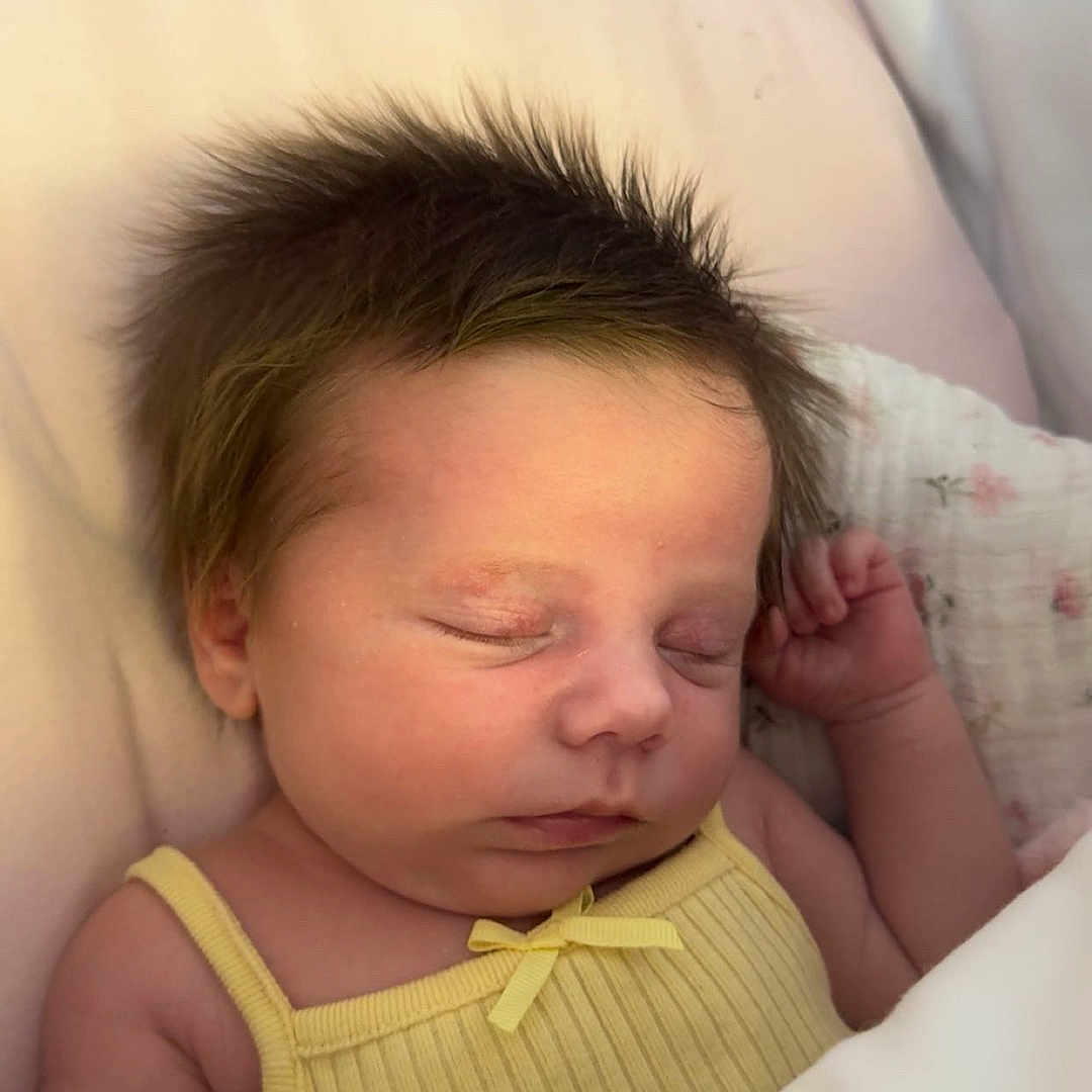 Lottie-Lil is registered to the contest to win money with this photo: baby, bed, blanket, child, cozy, cute, face, hair, indoors, infant, newborn, peaceful, person, portrait, resting, skin, sleeping, soft_light, tiny, yellow_clothing