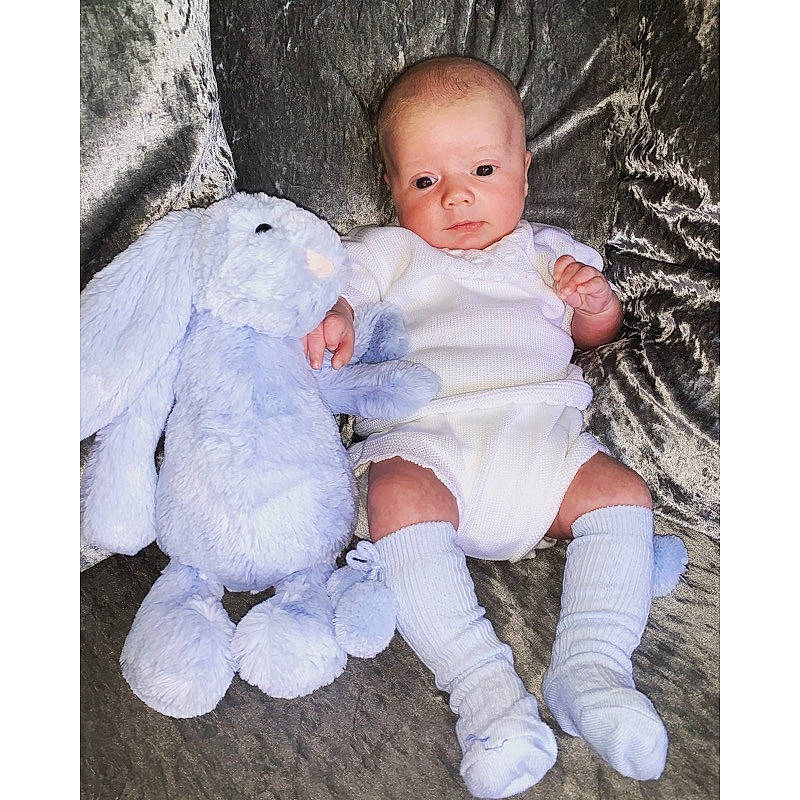 Georgie is registered to the contest to win money with this photo: baby, baby_products, baby_toddler_clothing, child, footwear, fur, person, photograph, photography, product, shoe, toddler