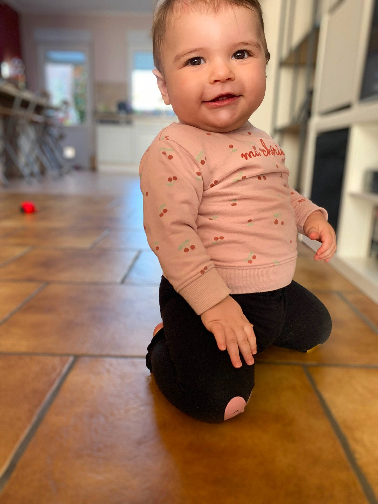 Alina participe au concours pour gagner de l'argent avec cette photo : baby, baby_toddler_clothing, cheek, collar, face, floor, flooring, foot, happy, hardwood, head, joy, knee, neck, nose, person, shoulder, skin, sleeve, smile