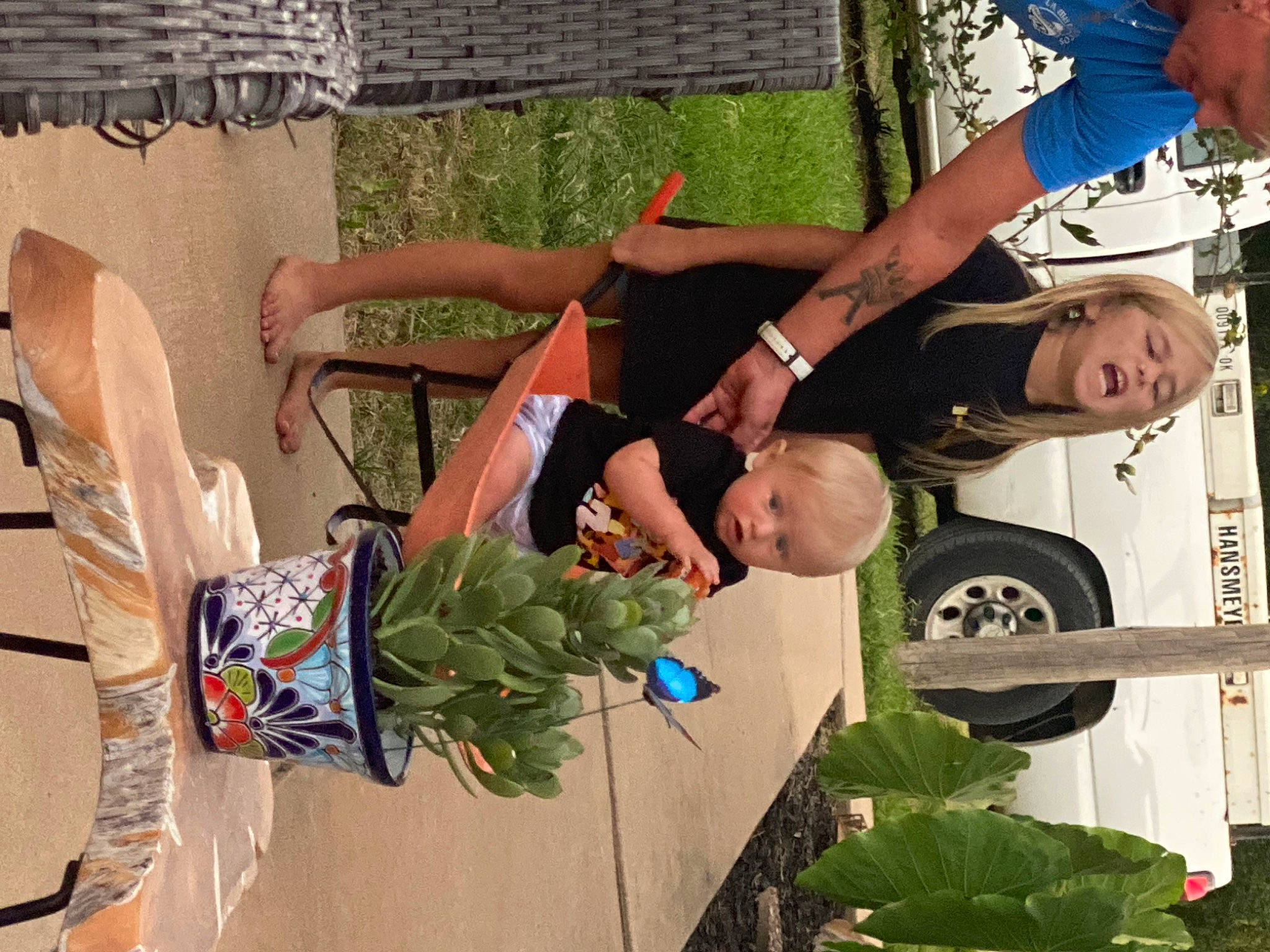 Charlee is registered to the contest to win money with this photo: community, event, floral_design, fun, grass, green, leaf_vegetable, leisure, military_camouflage, military_organization, military_uniform, motor_vehicle, person, plant, recreation, shorts, t_shirt, thigh, tire, visual_arts