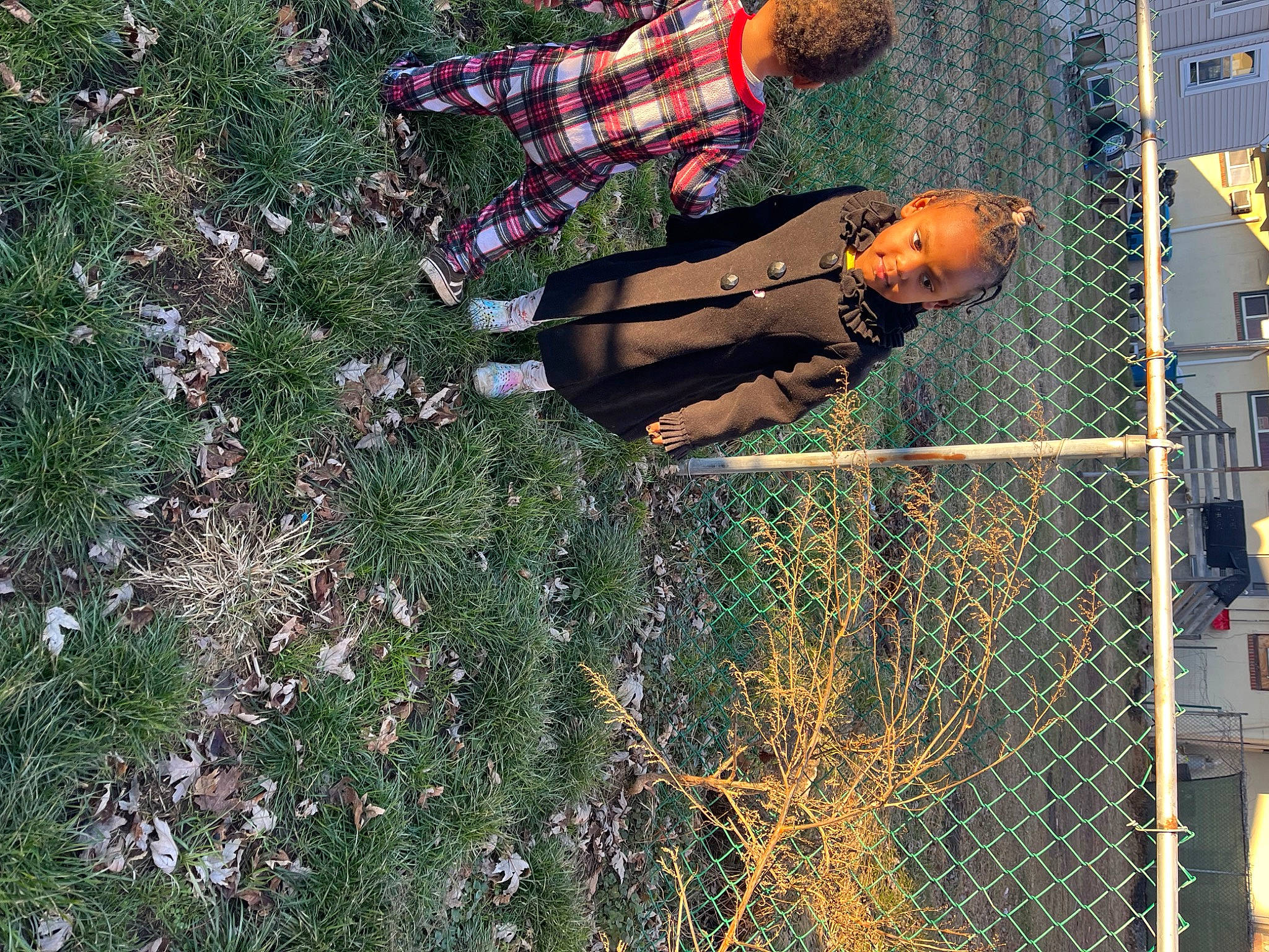 Brianna joined the competition — help win amazing prizes! building, chain_link_fencing, fence, fun, grass, mesh, metal, net, people_in_nature, person, plant, reflection, shadow, tints_and_shades, tire, tree, window, wire_fencing