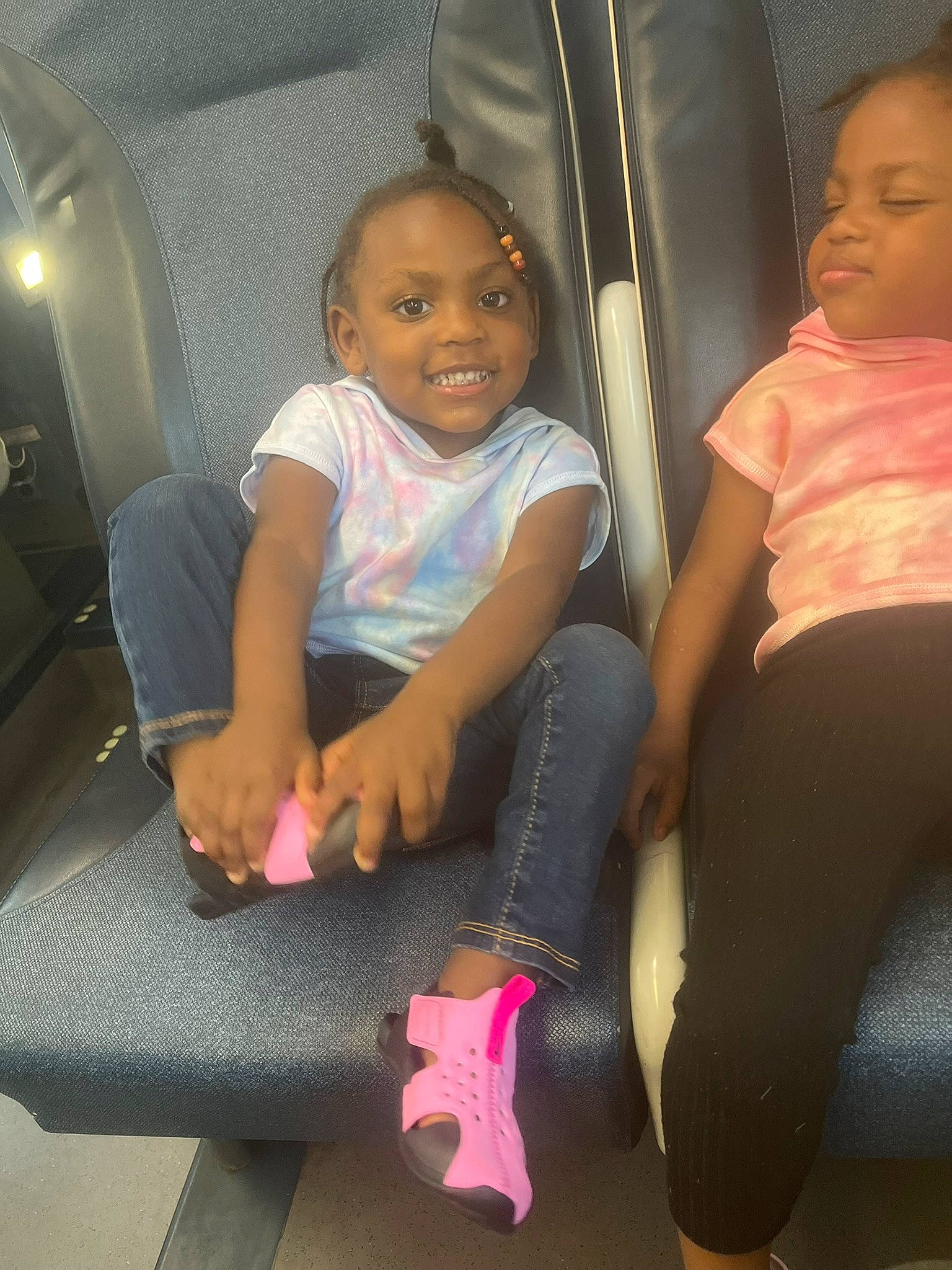 Brianna is registered to the contest to win money with this photo: baby_toddler_clothing, beauty, car_seat, comfort, cool, finger, fun, hairstyle, head, joint, joy, leg, mammal, mouth, person, pink, skin, smile, thigh, thumb