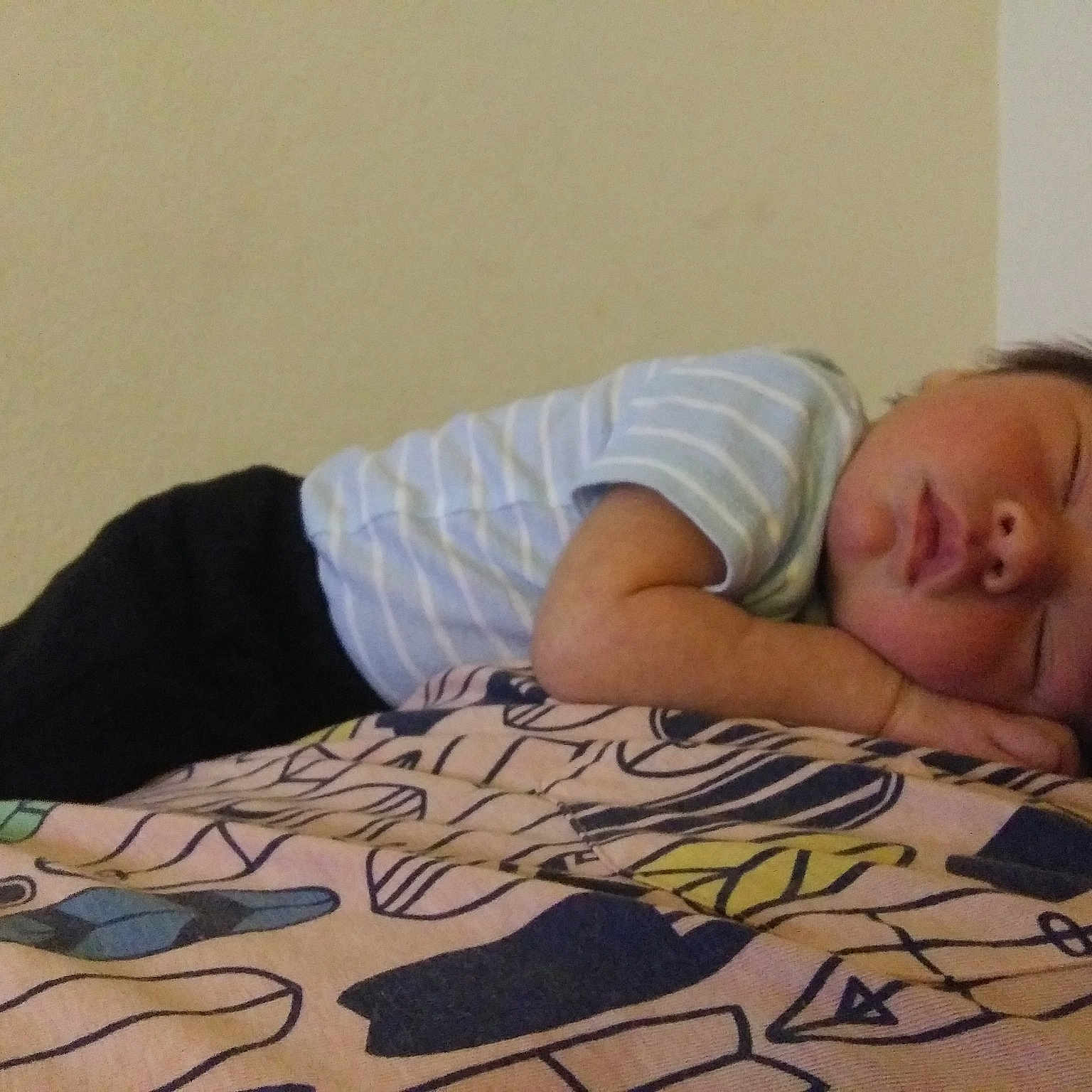 Sergio is registered to the contest to win money with this photo: baby, bed, bedtime, child, comfort, floor, flooring, furniture, nap, room, sleep, toddler, tummy_time