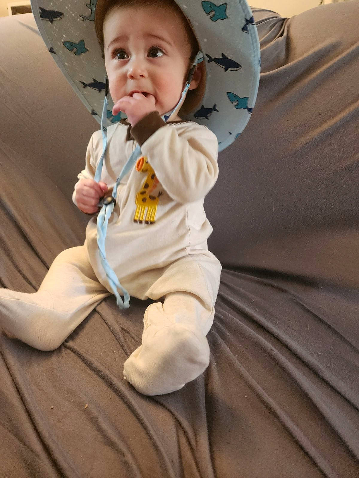 Benny is registered to the contest to win money with this photo: auto_part, baby, baby_products, baby_toddler_clothing, cap, car_seat, child, comfort, costume_hat, eye, fashion_accessory, fun, happy, hat, person, sitting, sleeve, smile, sun_hat, toddler