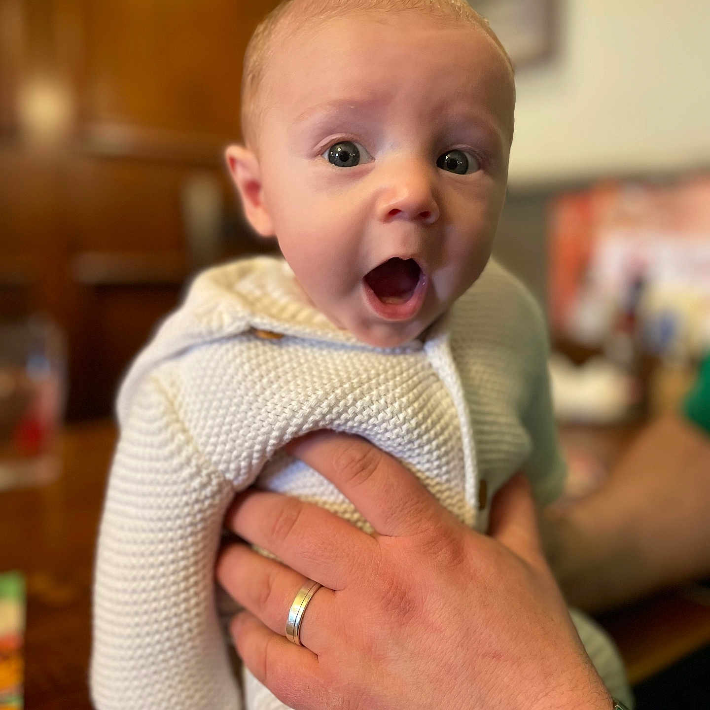 Leo is registered to the contest to win money with this photo: accessories, arm, baby, bodypart, bracelet, clothing, face, finger, hand, head, jewelry, knitwear, newborn, person, photography, portrait, ring, sweater, wrist, wristwatch