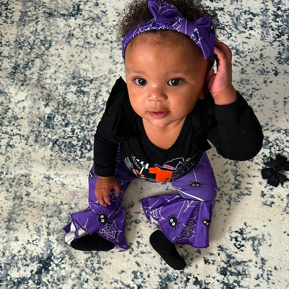 Grace joined the competition — help win amazing prizes! accessories, baby, bodypart, clothing, dress, face, finger, footwear, formalwear, glove, hand, head, headband, jewelry, pants, person, photography, portrait, purple, shoe