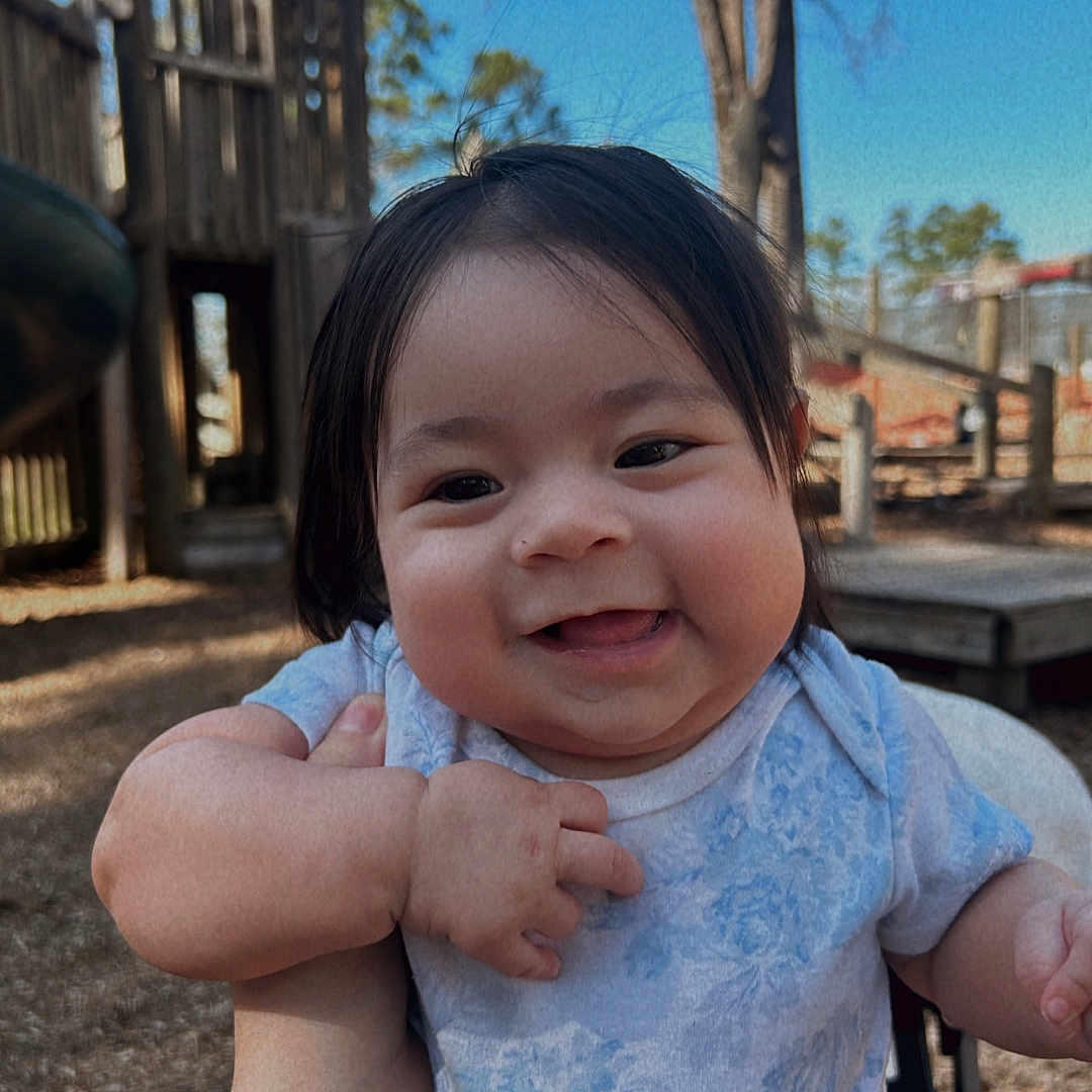 Lynette joined the competition — help win amazing prizes! baby, bodypart, face, finger, grass, hand, happy, head, outdoorplayarea, outdoors, person, photography, plant, playarea, portrait, skin, smile, tattoo, tree, wood