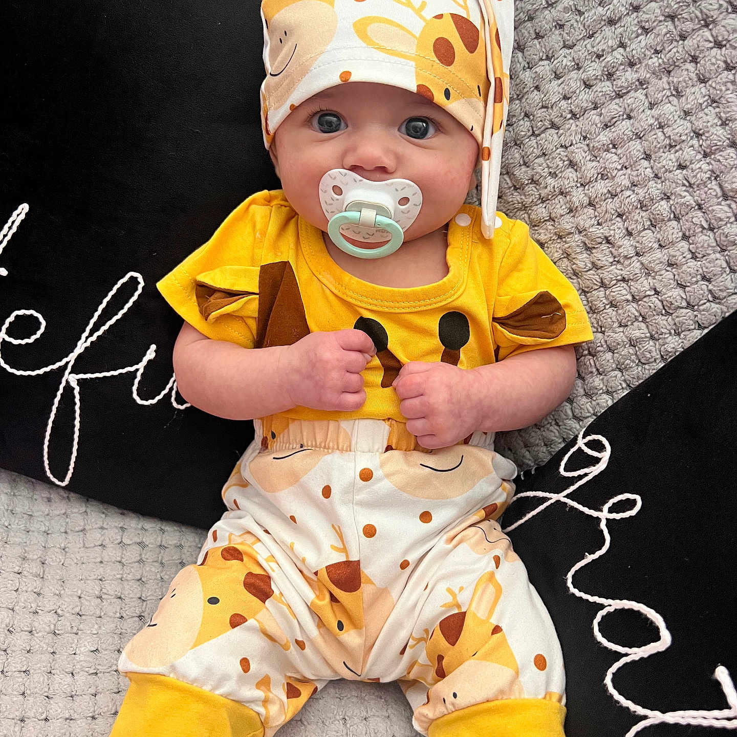 Brianna joined the competition — help win amazing prizes! baby, bodypart, bonnet, cap, clothing, costume, couch, cushion, dress, face, furniture, hat, head, homedecor, pants, person, photography, portrait, shorts, sitting