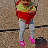 Evangeline is registered to the contest to win money with this photo: child, toddler, swing, playground, outdoor, curly_hair, smiling, red_swing, pink_shoes, leggings, grass, wood_chips, sunny_day, person, happy, play, fun, clothing, park, nature