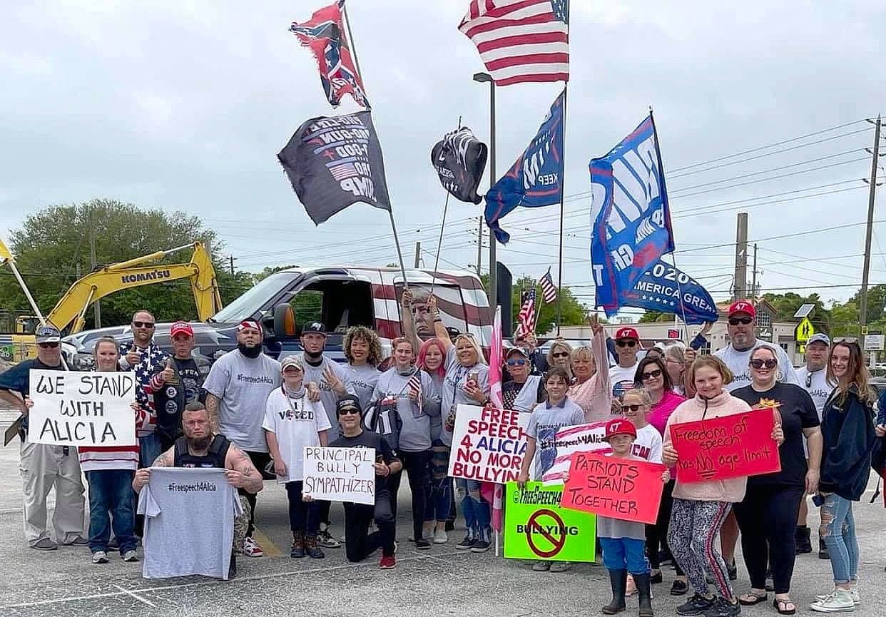 Alicia joined the competition — help win amazing prizes! banner, cloud, crowd, event, flag, flag_of_the_united_states, hat, headwear, jeans, joy, motor_vehicle, people, person, pole, protest, public_event, rebellion, sky, social_work, t_shirt