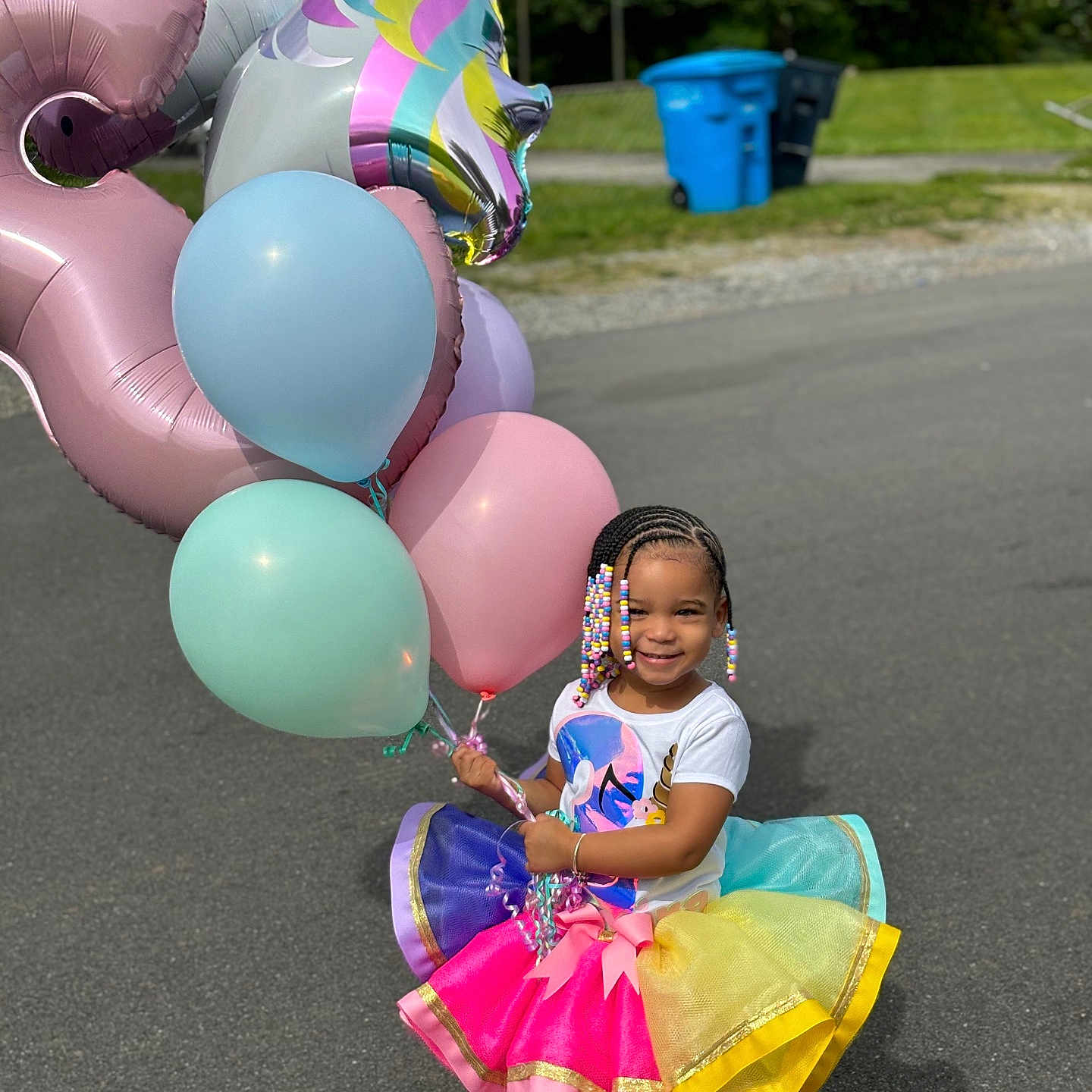 Amira is registered to the contest to win money with this photo: accessories, bag, balloon, child, city, clothing, dress, face, female, girl, handbag, head, people, person, photography, portrait, purple, road, skirt, street