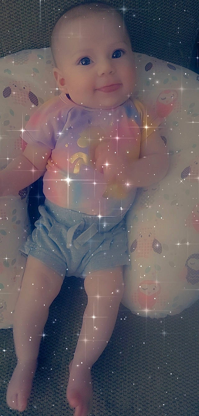 Lilliana is registered to the contest to win money with this photo: abdomen, arm, chest, cool, doll, electric_blue, fun, hand, happy, human_body, human_leg, leg, performing_arts, person, pink, shorts, smile, thigh, toddler, toy