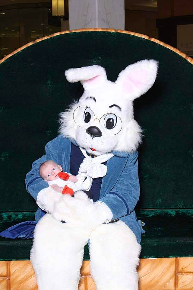 Colton is registered to the contest to win money with this photo: animation, child, cosplay, costume, costume_hat, easter_bunny, event, fawn, fictional_character, fun, fur, glove, happy, hat, mascot, person, pink, plush, stuffed_toy, tail