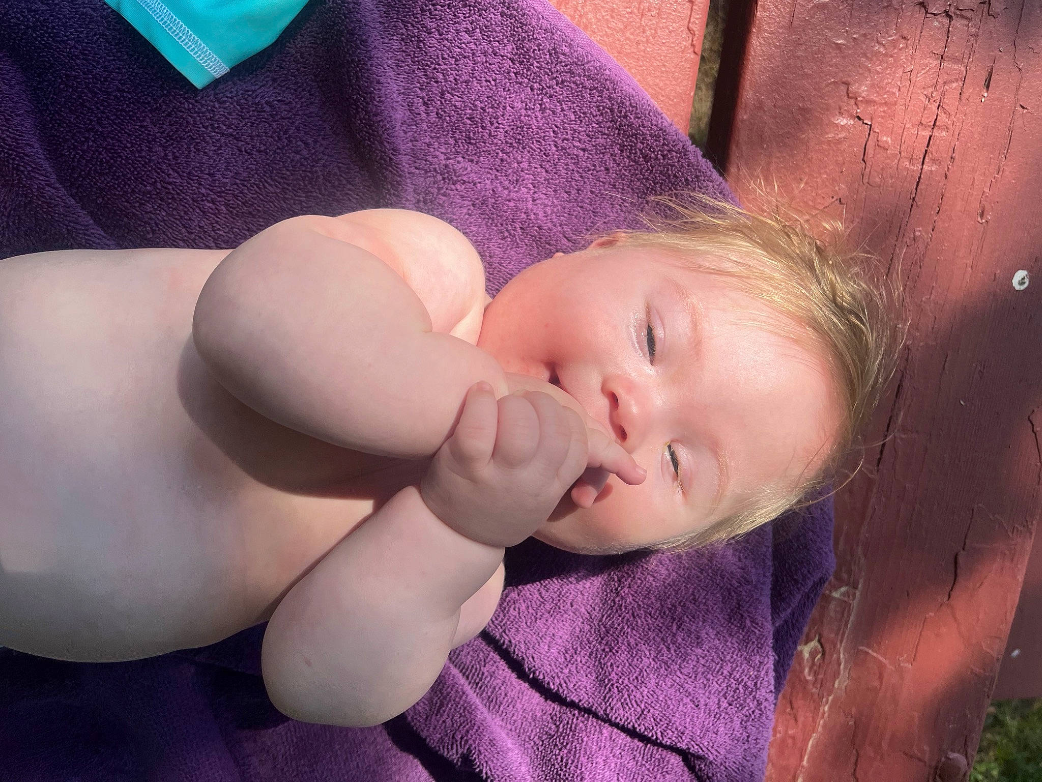 Weston is registered to the contest to win money with this photo: abdomen, baby, cheek, chest, child, comfort, eyelash, gesture, human_leg, knee, lip, neck, nose, person, pink, purple, skin, thigh, thumb, toddler