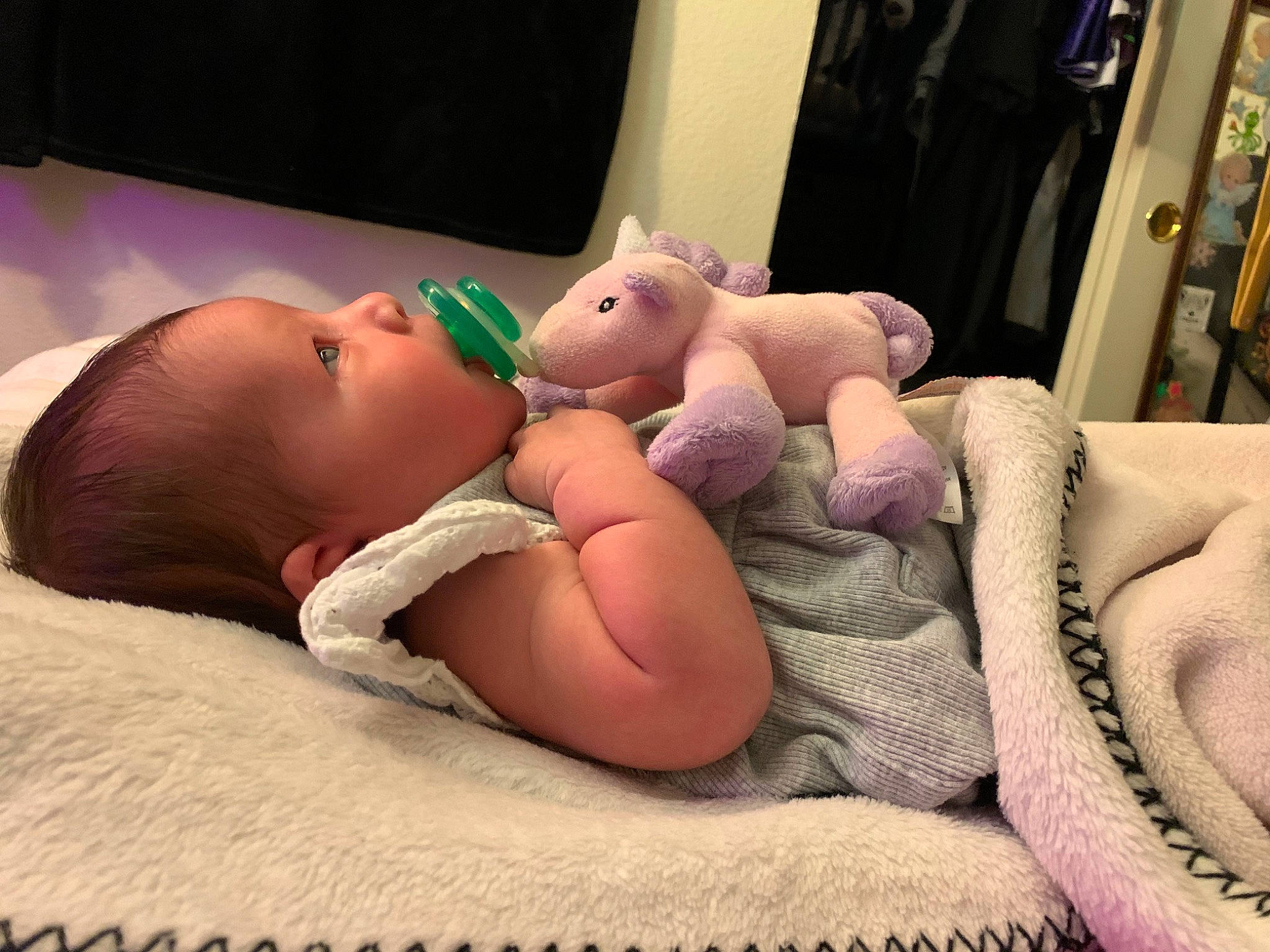 Cleopatra is registered to the contest to win money with this photo: baby, bedtime, cheek, child, comfort, electronic_device, eye, finger, hand, leg, mouth, muscle, person, pink, product, room, skin, stuffed_toy, thigh, thumb
