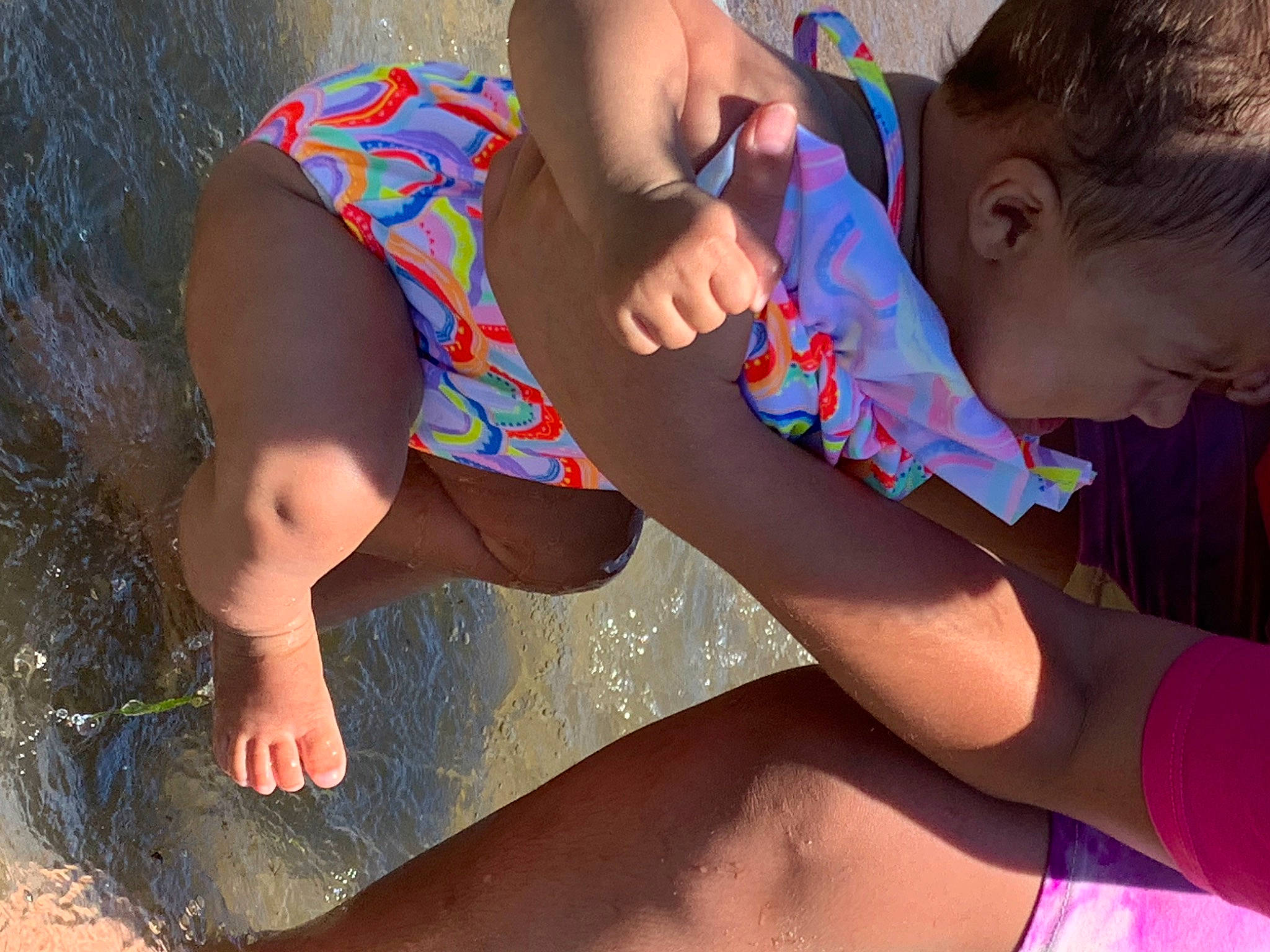 Amiyah is registered to the contest to win money with this photo: arm, elbow, finger, grass, hand, happy, head, human_body, joint, knee, leg, leisure, neck, people_in_nature, person, shoulder, skin, sunlight, thigh, toddler
