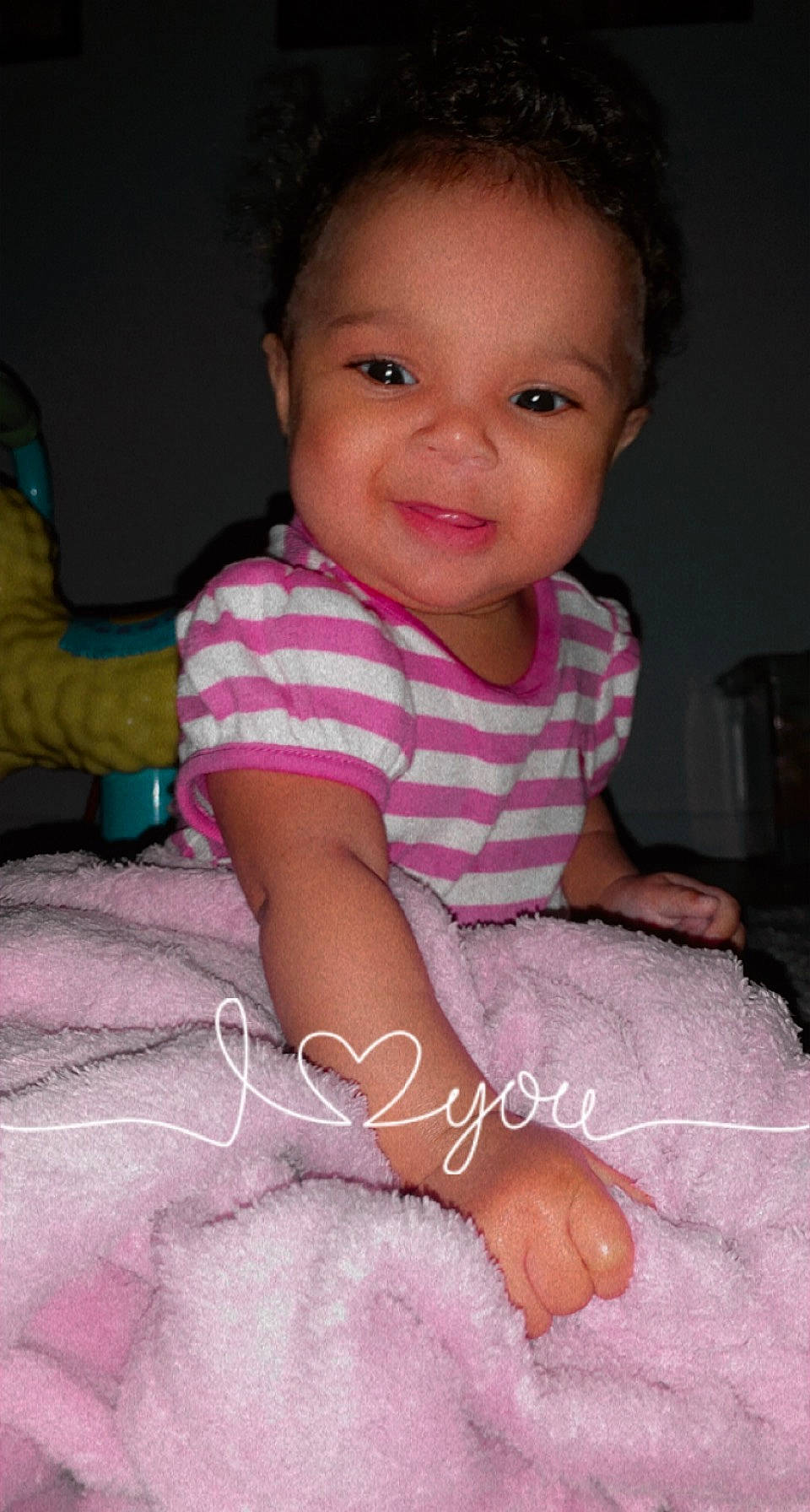 Amiyah is registered to the contest to win money with this photo: arm, baby_toddler_clothing, cheek, eye, eyebrow, face, facial_expression, finger, gesture, hairstyle, head, iris, joy, lip, nose, organ, person, pink, purple, skin