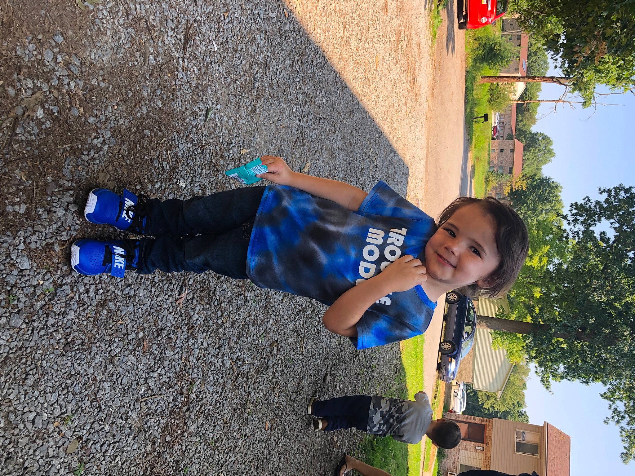 Alec James joined the competition — help win amazing prizes! asphalt, child, city, concrete, denim, electric_blue, fun, joy, leisure, line, person, plant, road_surface, shadow, sky, smile, sneakers, t_shirt, toddler, travel