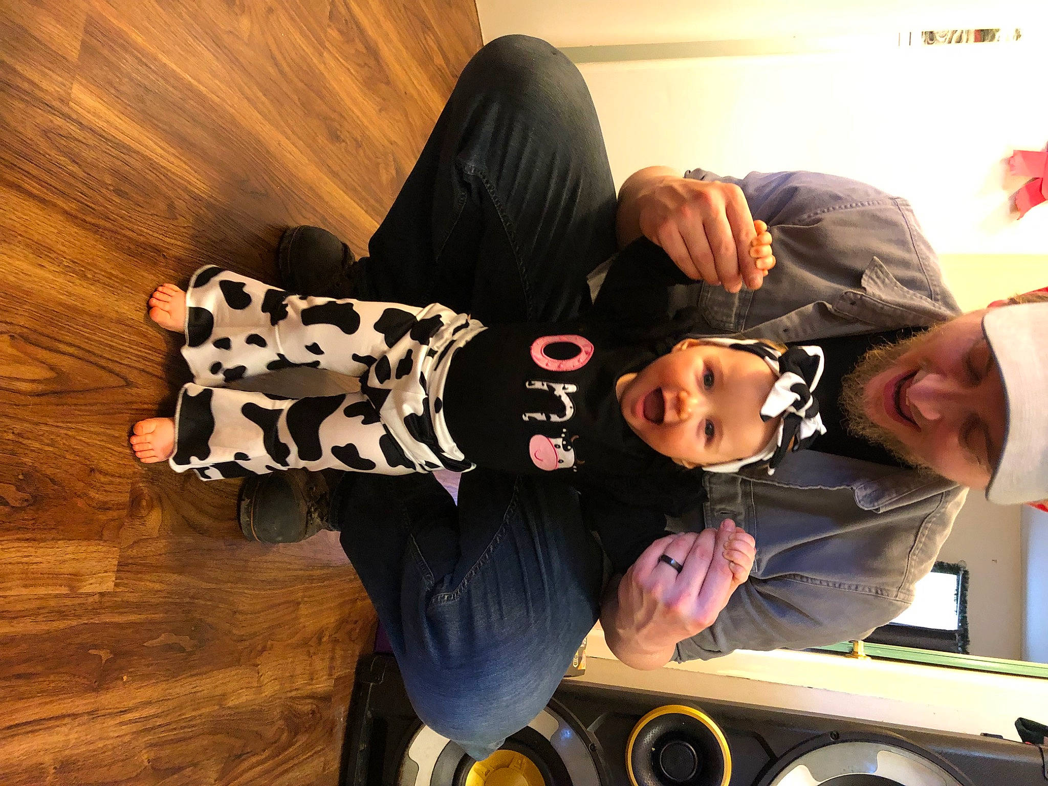 Allison is registered to the contest to win money with this photo: automotive_lighting, automotive_tire, comfort, elbow, flooring, fun, happy, hardwood, hat, headwear, joy, motor_vehicle, person, rim, rolling, sitting, sleeve, smile, t_shirt, tire