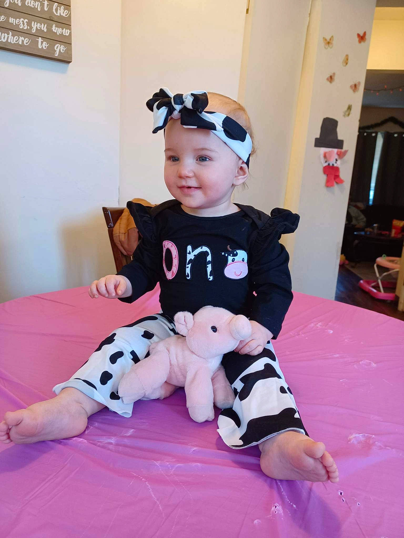 Allison joined the competition — help win amazing prizes! baby, baby_toddler_clothing, carmine, child, costume, event, flooring, fun, happy, headwear, human_leg, joy, person, picture_frame, pink, purple, room, sitting, sleeve, smile