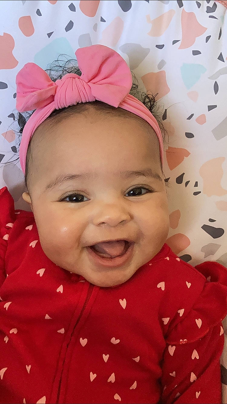 Shaylee Rose is registered to the contest to win money with this photo: baby, baby_toddler_clothing, cheek, chin, eye, eyebrow, face, facial_expression, happy, head, human, lip, nose, person, pink, product, skin, sleeve, smile, textile