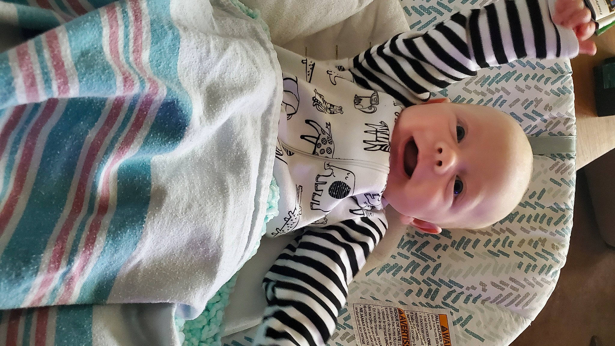 Zach is registered to the contest to win money with this photo: baby, baby_products, baby_toddler_clothing, cheek, child, clothing, comfort, design, eyelash, fur, happy, linens, mammal, pattern, person, sleeve, smile, textile, toddler, wood