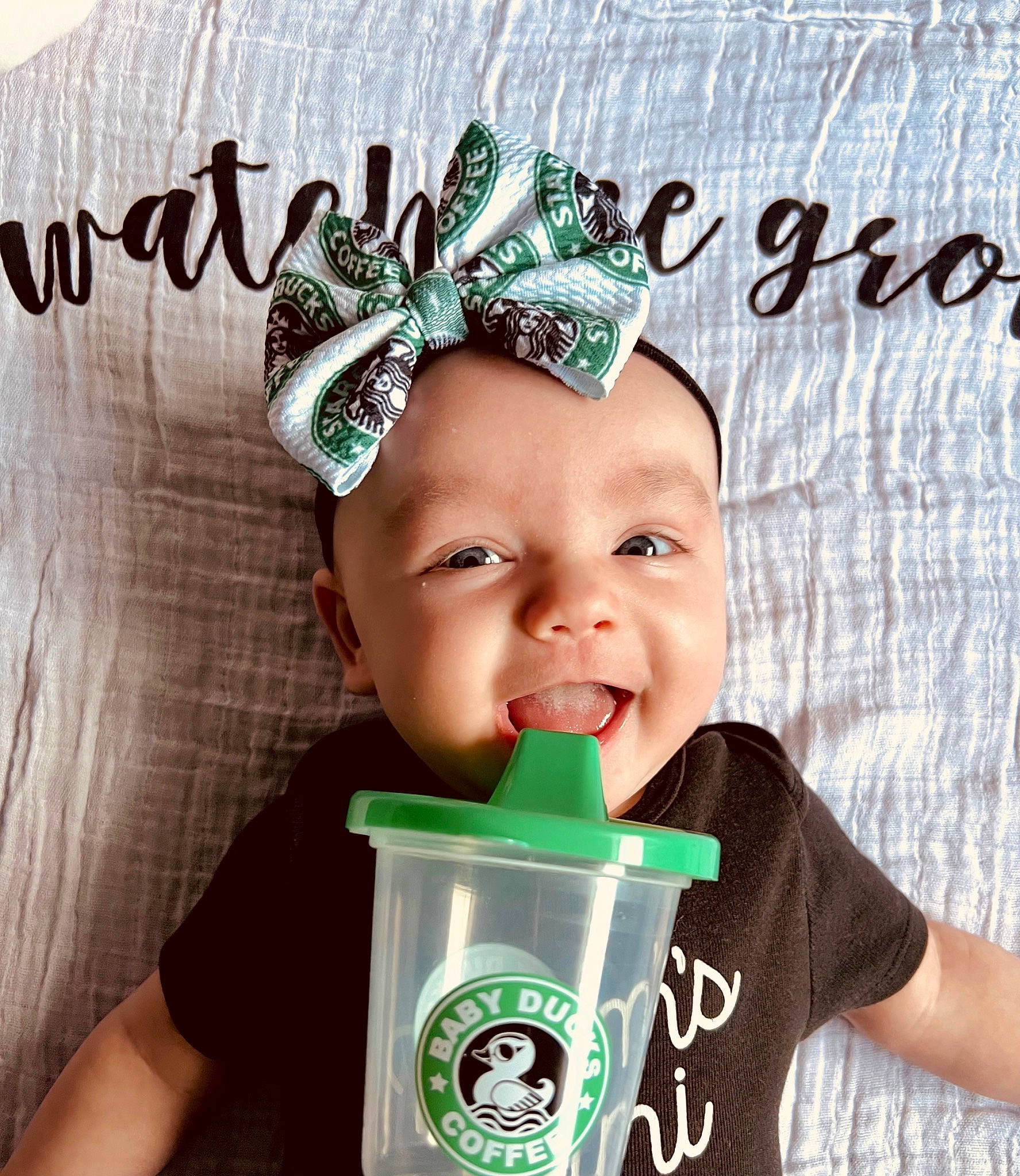Lorelai is registered to the contest to win money with this photo: baby_toddler_clothing, cap, child, cool, costume_hat, crown, drink, drinkware, fashion_accessory, font, green, hair_accessory, happy, headpiece, headwear, holiday, person, product, sleeve, smile