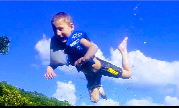 Camden joined the competition — help win amazing prizes! azure, cloud, cumulus, electric_blue, flash_photography, fun, gesture, grass, happy, leisure, meteorological_phenomenon, people_in_nature, person, recreation, shorts, sky, smile, thumb, toddler, travel